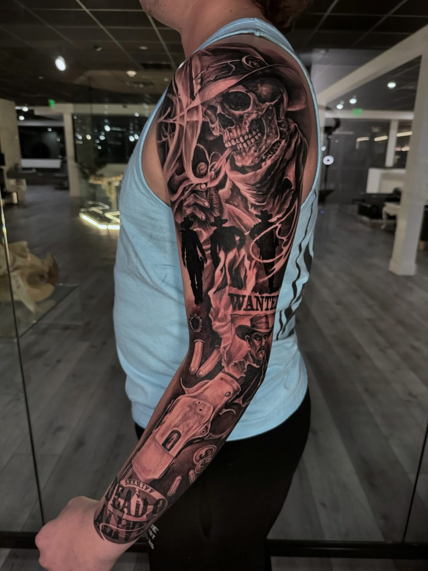 Black and grey Western skull and cowboy sleeve